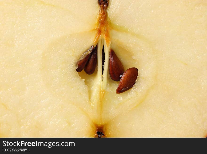 Closeup of an juicy fresh apple inside showing seeds and core. Closeup of an juicy fresh apple inside showing seeds and core.