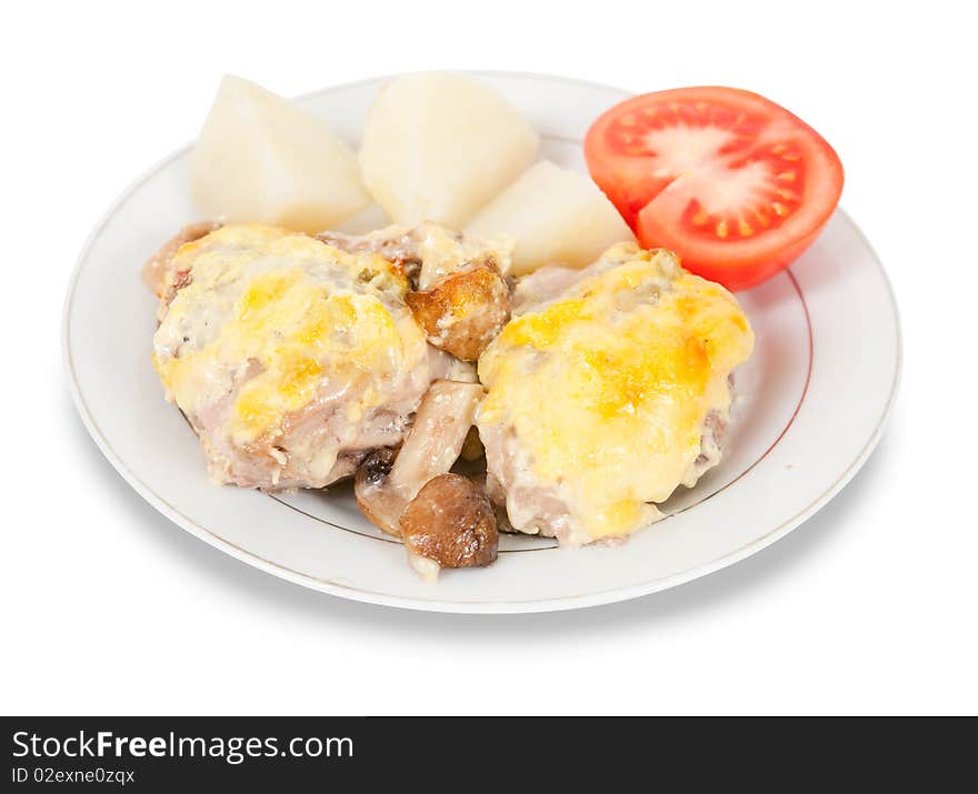 Stewed chicken with mushrooms and cheese on plate. Stewed chicken with mushrooms and cheese on plate