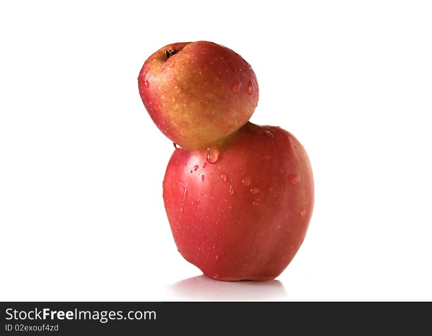 Two connected apples on the white background. Two connected apples on the white background