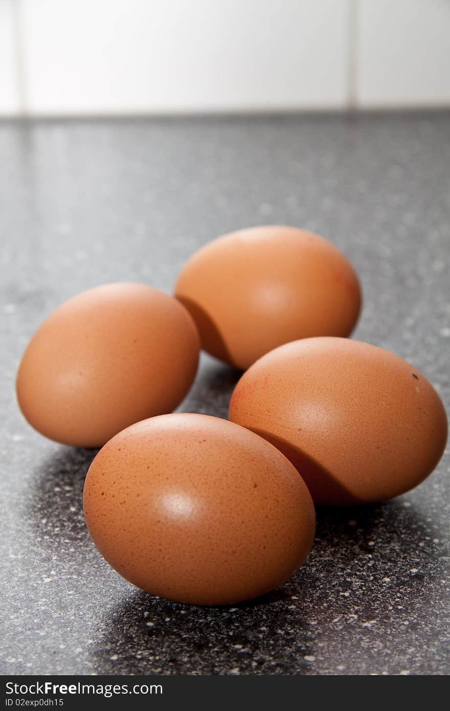 Fresh brown eggs standing in the kitchen