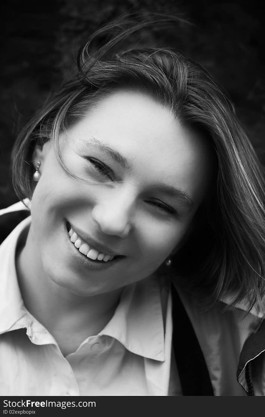 Portrait of smiling woman in black and white