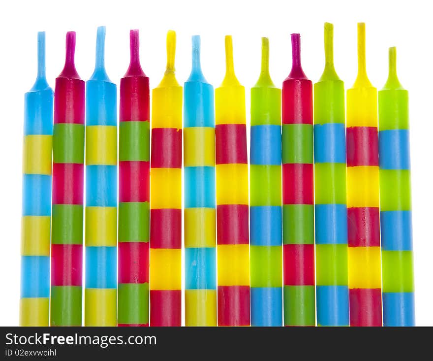 Vibrant Birthday Candles with stripes.  Isolated on white with a clipping path.