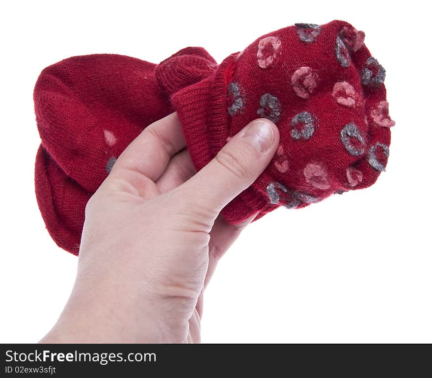 Pair of Red Socks being folded up after the laundry.  Isolated on White with a Clipping Path.