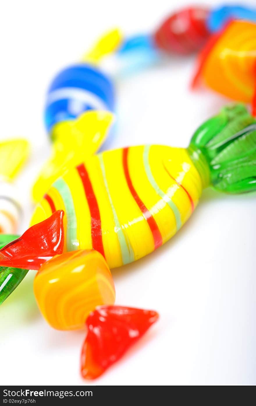 Delicious multi colored candies on white background