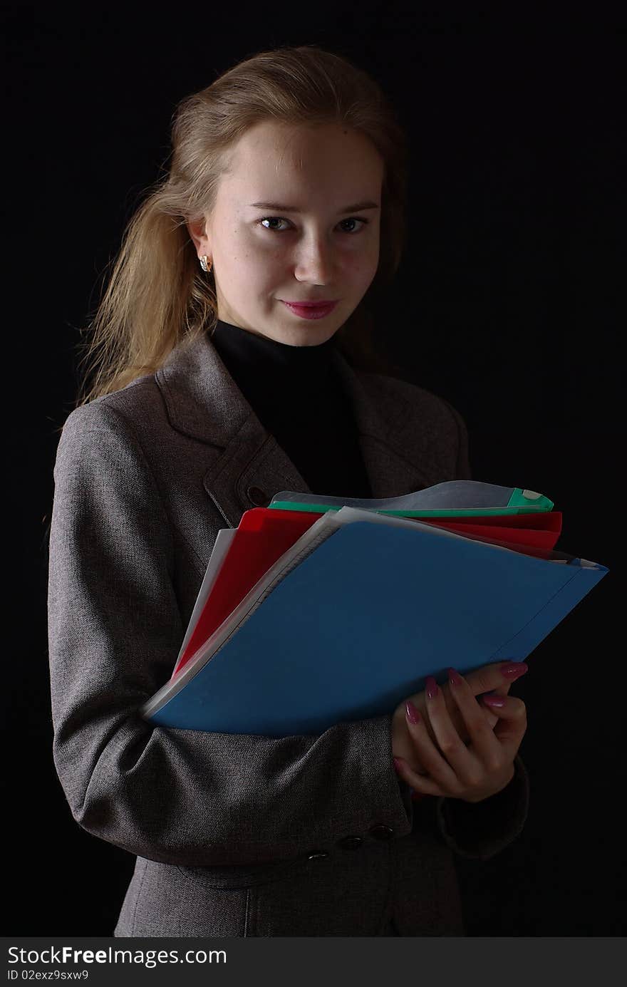 Reading business woman folders on black background