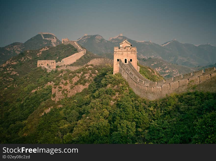 Part of Great Wall surrounded by green trees, China