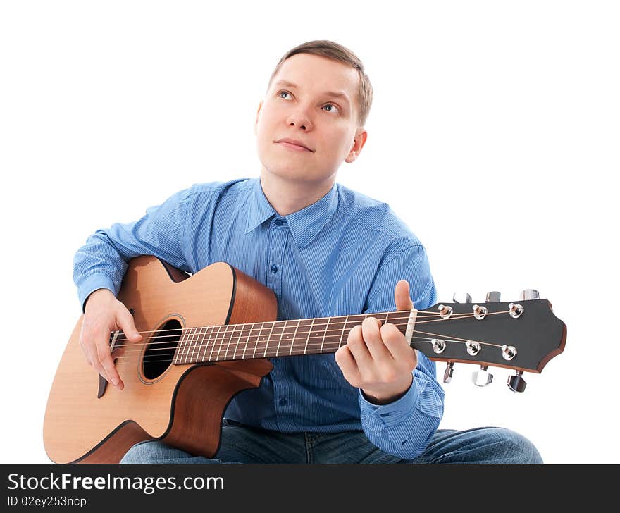 Young Male Guitarist with his acoustic guitar