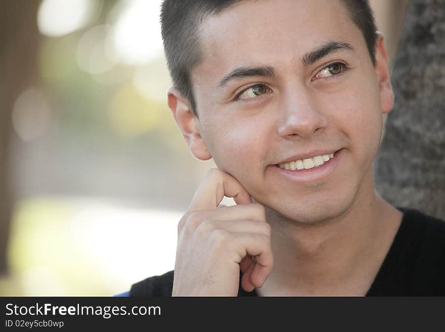 Headshot of a man by a tree