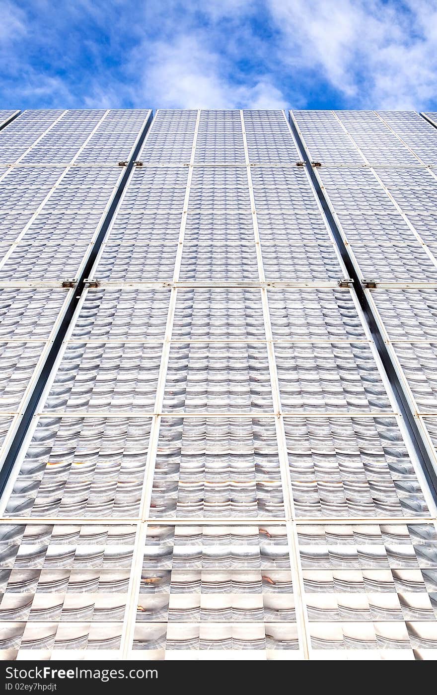 Solar battery panels and blue sky on background