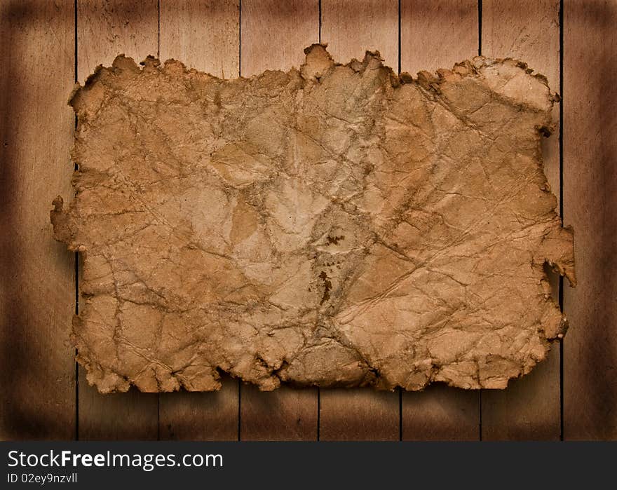 Old paper on a wooden background for your illustrations