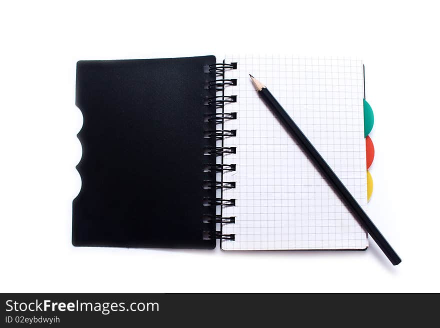 Notebook with a spring and pencil on a white background