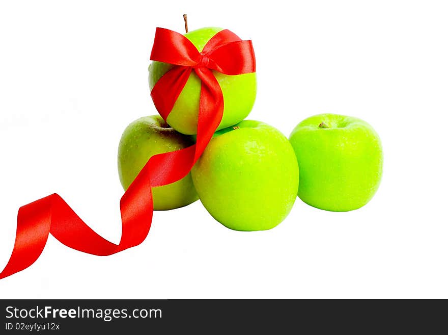 The green apple is decorated red by a tape allocated among others