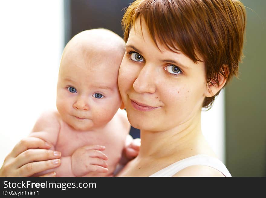 Closeup portrait happy young mother with baby boy