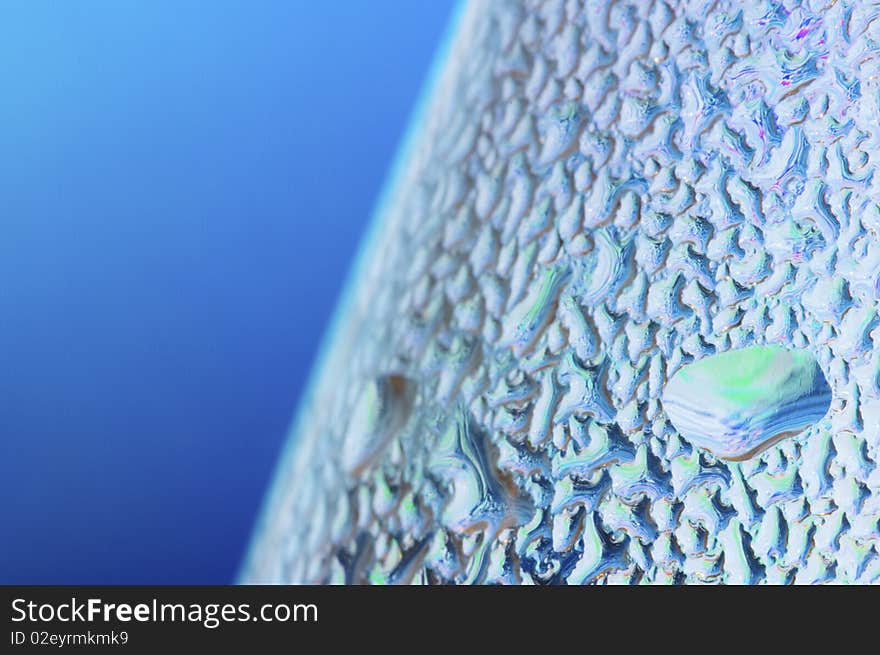 Abstract texture formed by water droplets on a blue background