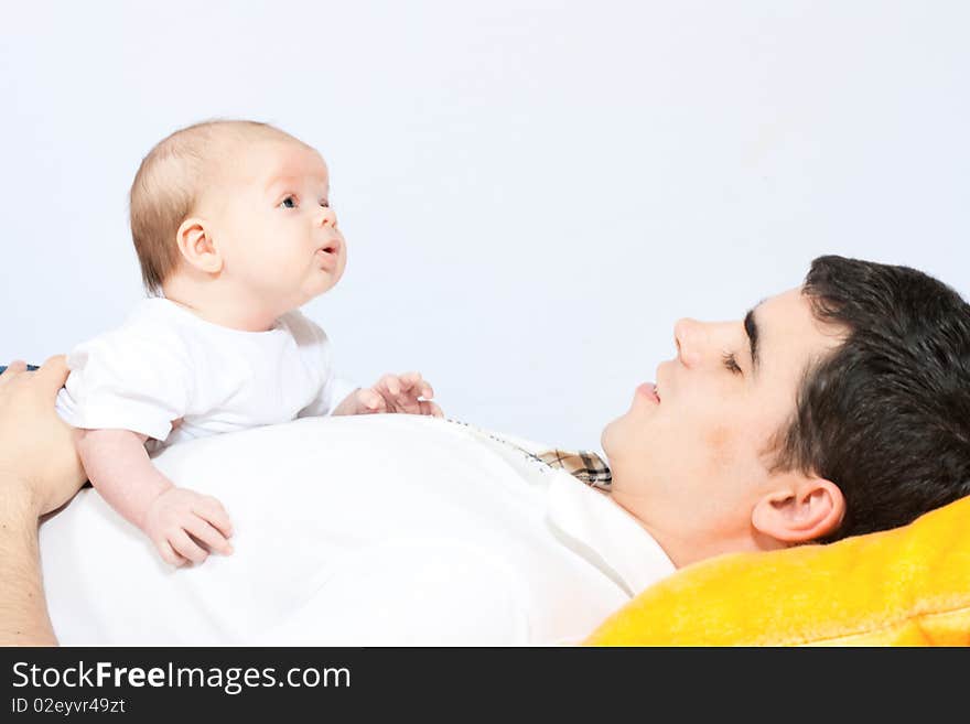 Happy family home: father playing with his little baby. Happy family home: father playing with his little baby