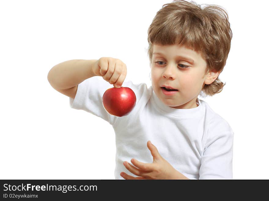 Little beautiful child playing and eating an apple - isolated on white. Little beautiful child playing and eating an apple - isolated on white