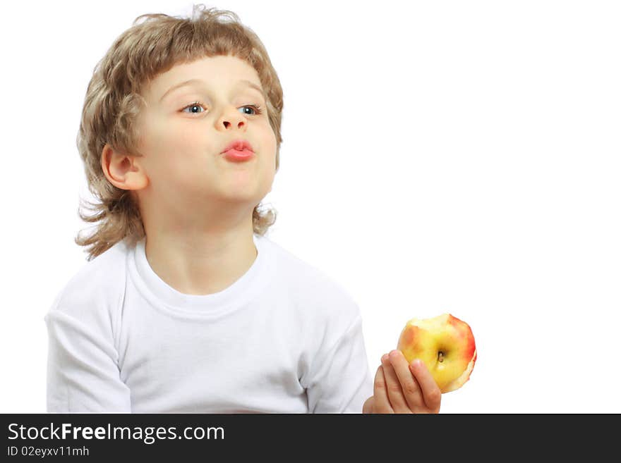 Little beautiful child playing and eating an apple - isolated on white. Little beautiful child playing and eating an apple - isolated on white