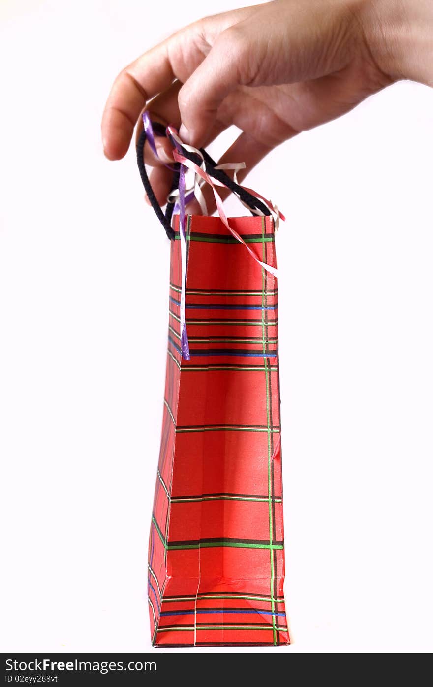 Close-up on a red shopping bag, isolated on white