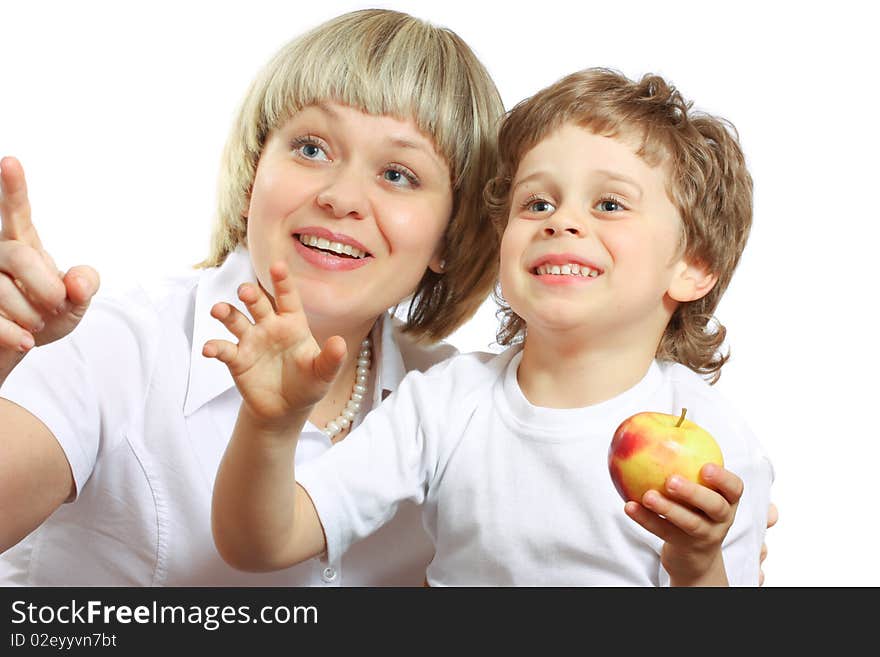 Woman and boy eating apple