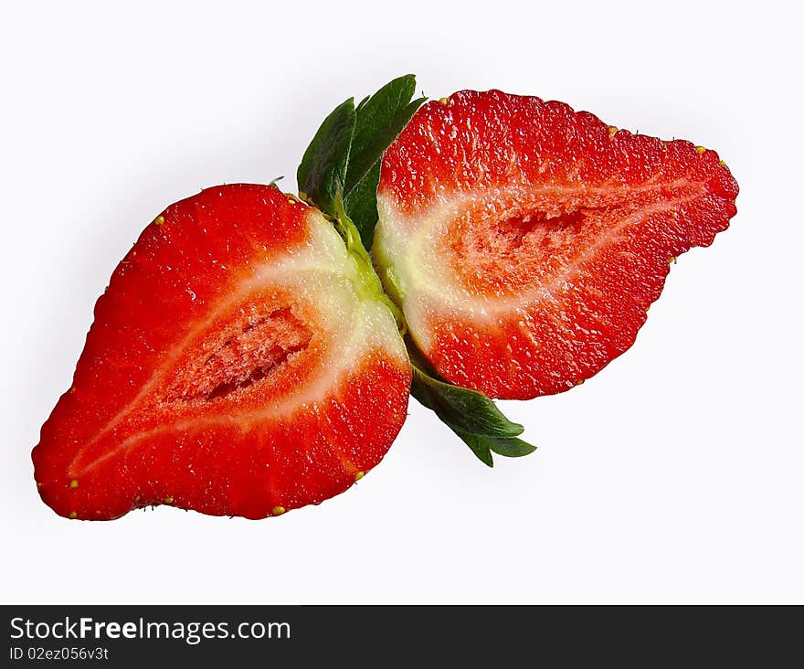 Strawberries cut in half on a white background. Strawberries cut in half on a white background