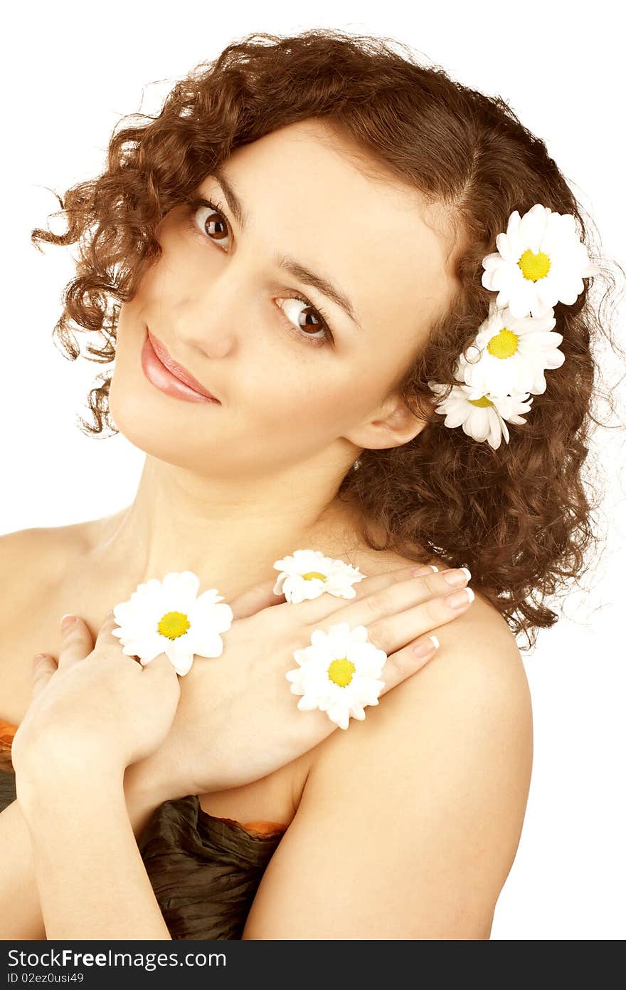 Beautiful woman with camomile flower on white background