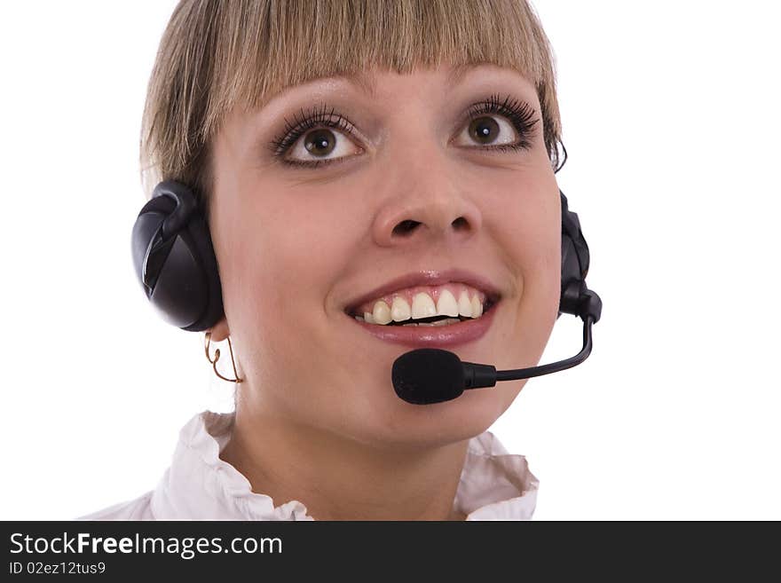 Telephone operator is looking up. Successful  businesswoman is speaking over the headset with a microphone. Woman with headset