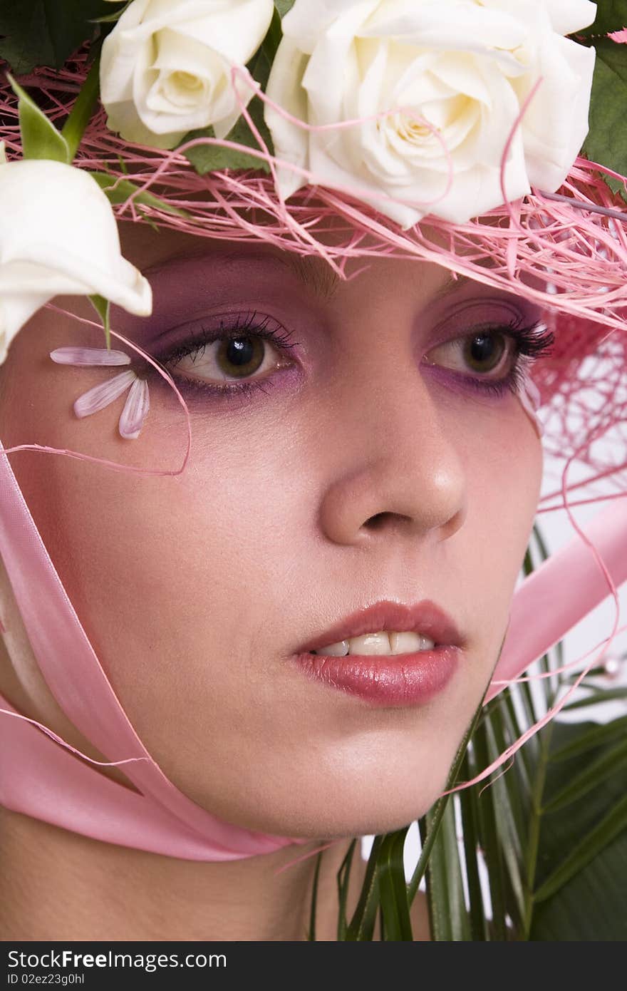 Elegant model with roses in her hat