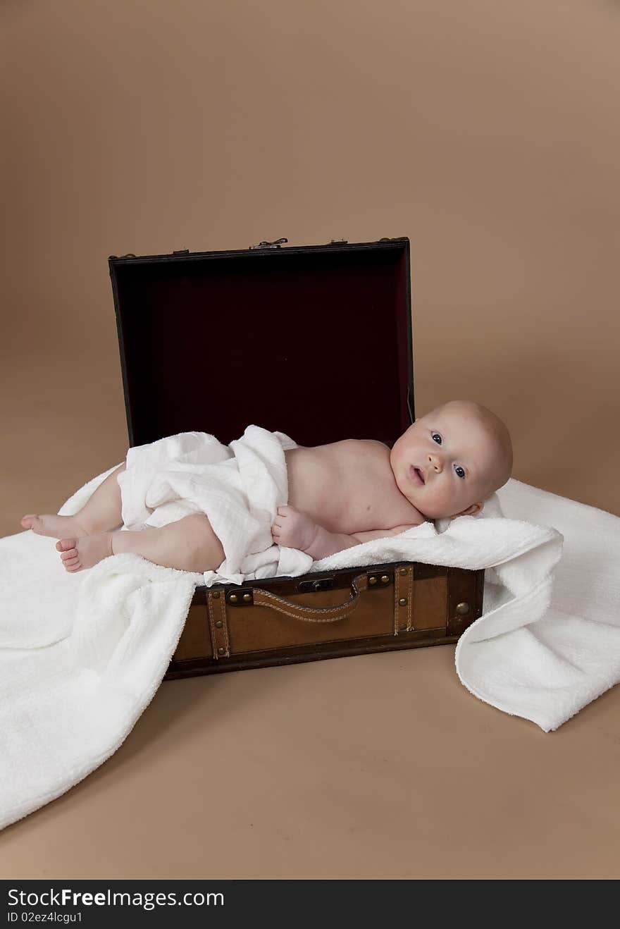 Close up of baby in the suitcase