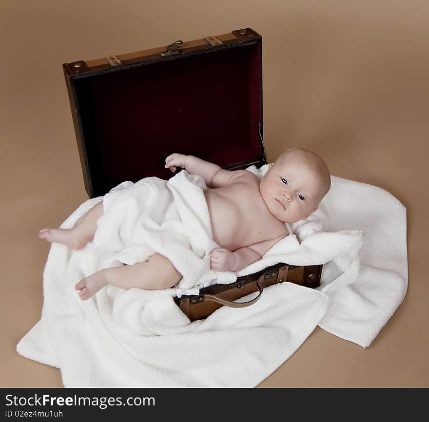 Close up of baby in the suitcase