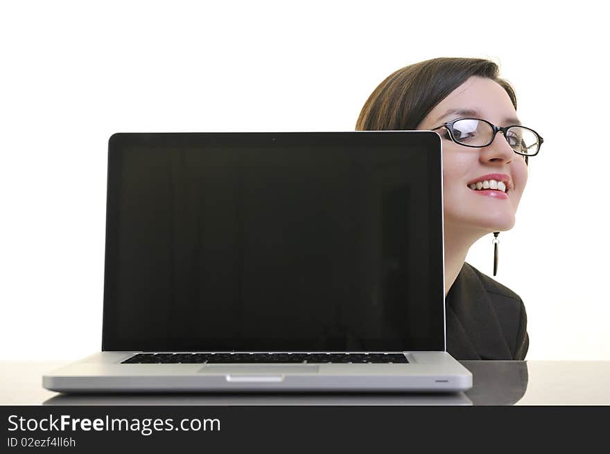 Business woman working on laptop isolated on white