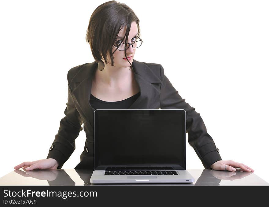 Business woman working on laptop isolated on white