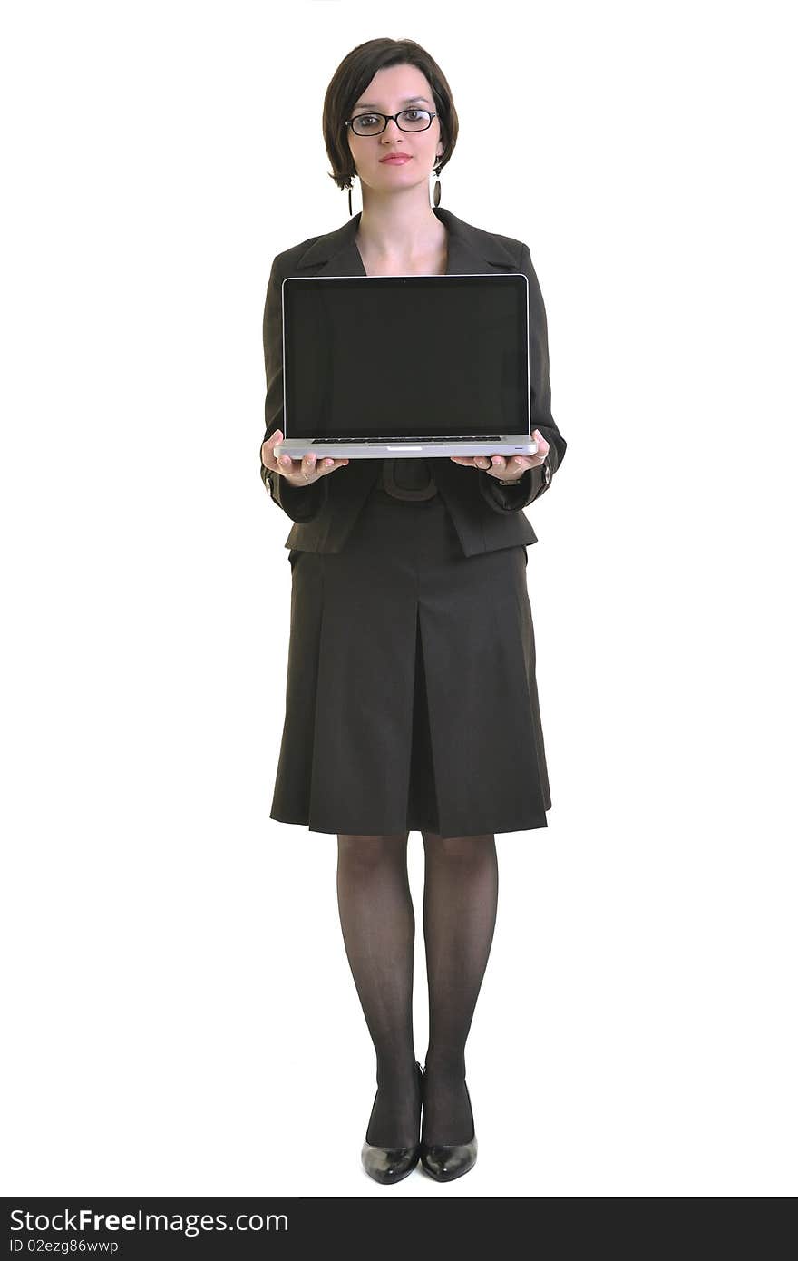 One young business woman isolated on white working on laptop computer. One young business woman isolated on white working on laptop computer