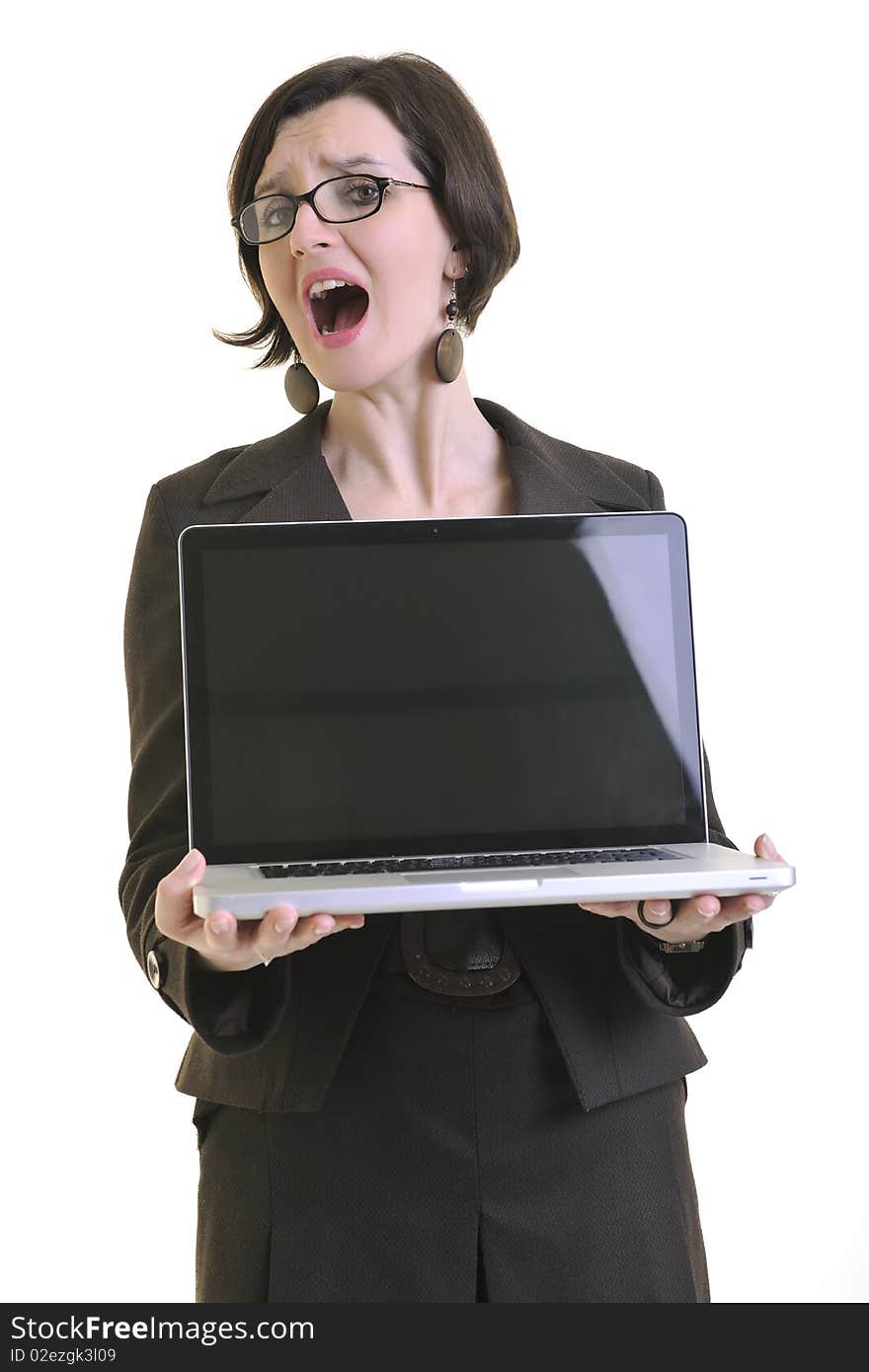 One young business woman isolated on white working on laptop computer. One young business woman isolated on white working on laptop computer