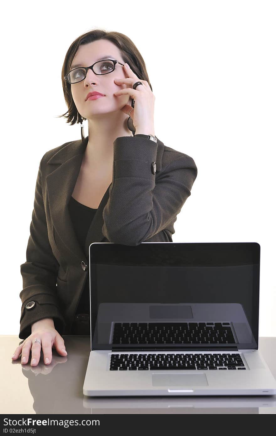 One young business woman isolated on white working on laptop computer. One young business woman isolated on white working on laptop computer