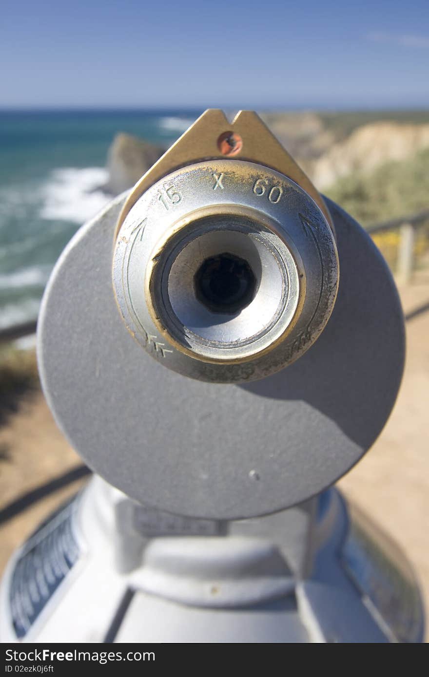 Coin operated telescope in a cosatline viewpoint overlooking the ocean (Pay per view concept)