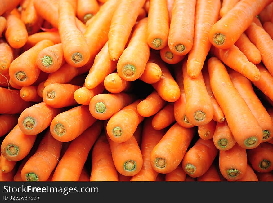 A pile of carrots in a market in Thailand