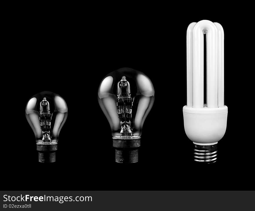 An energy saving light bulb isolated against a black background