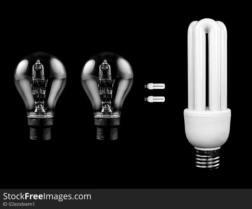 An energy saving light bulb isolated against a black background