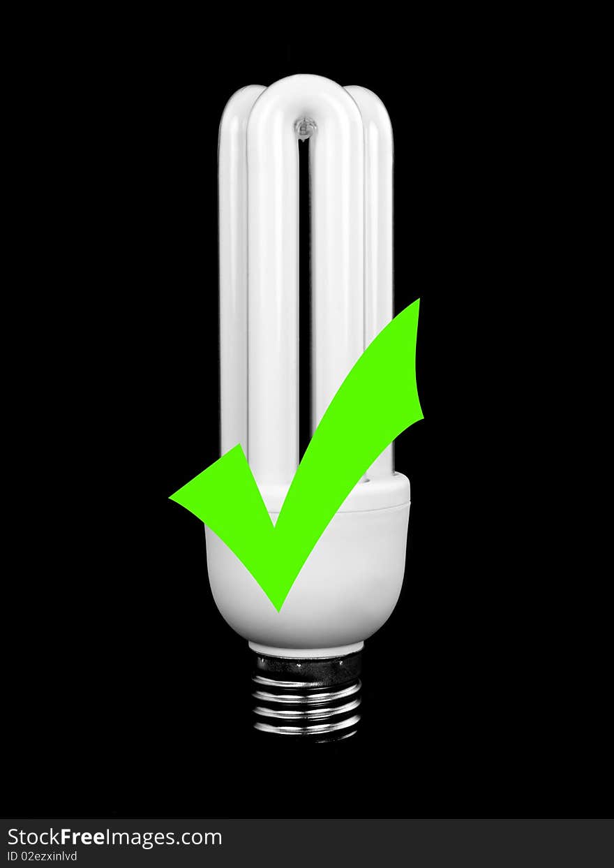 An energy saving light bulb isolated against a black background