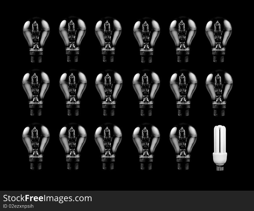 An energy saving light bulb isolated against a black background