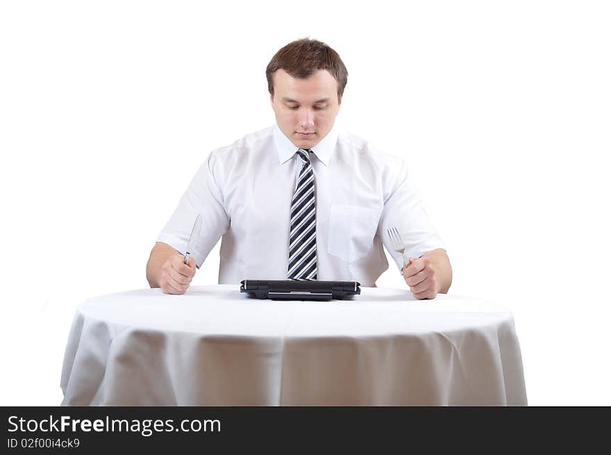 Businessman in suit is preparing to eat a notebook. Businessman in suit is preparing to eat a notebook