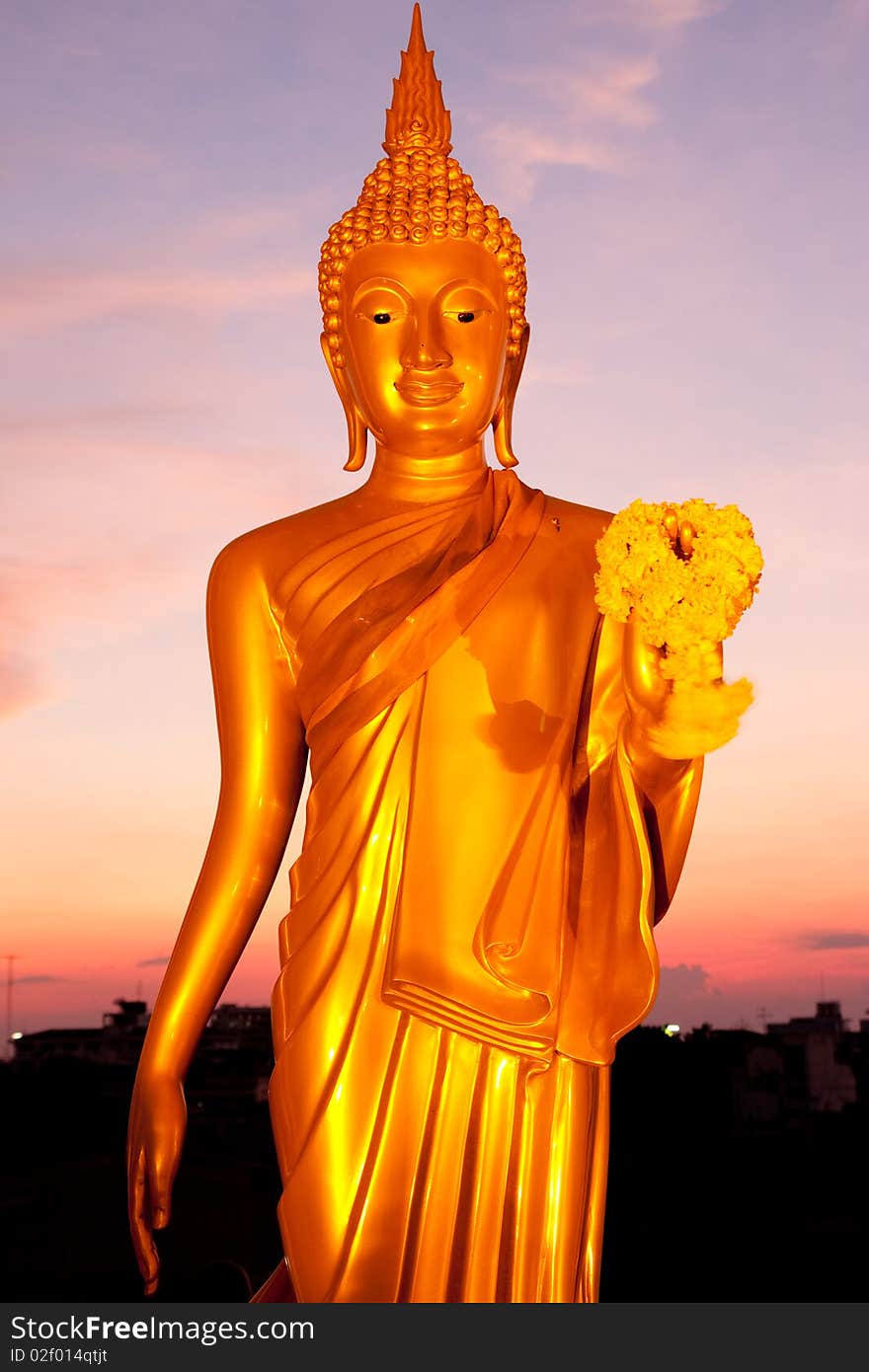 Golden standing Buddha image statue