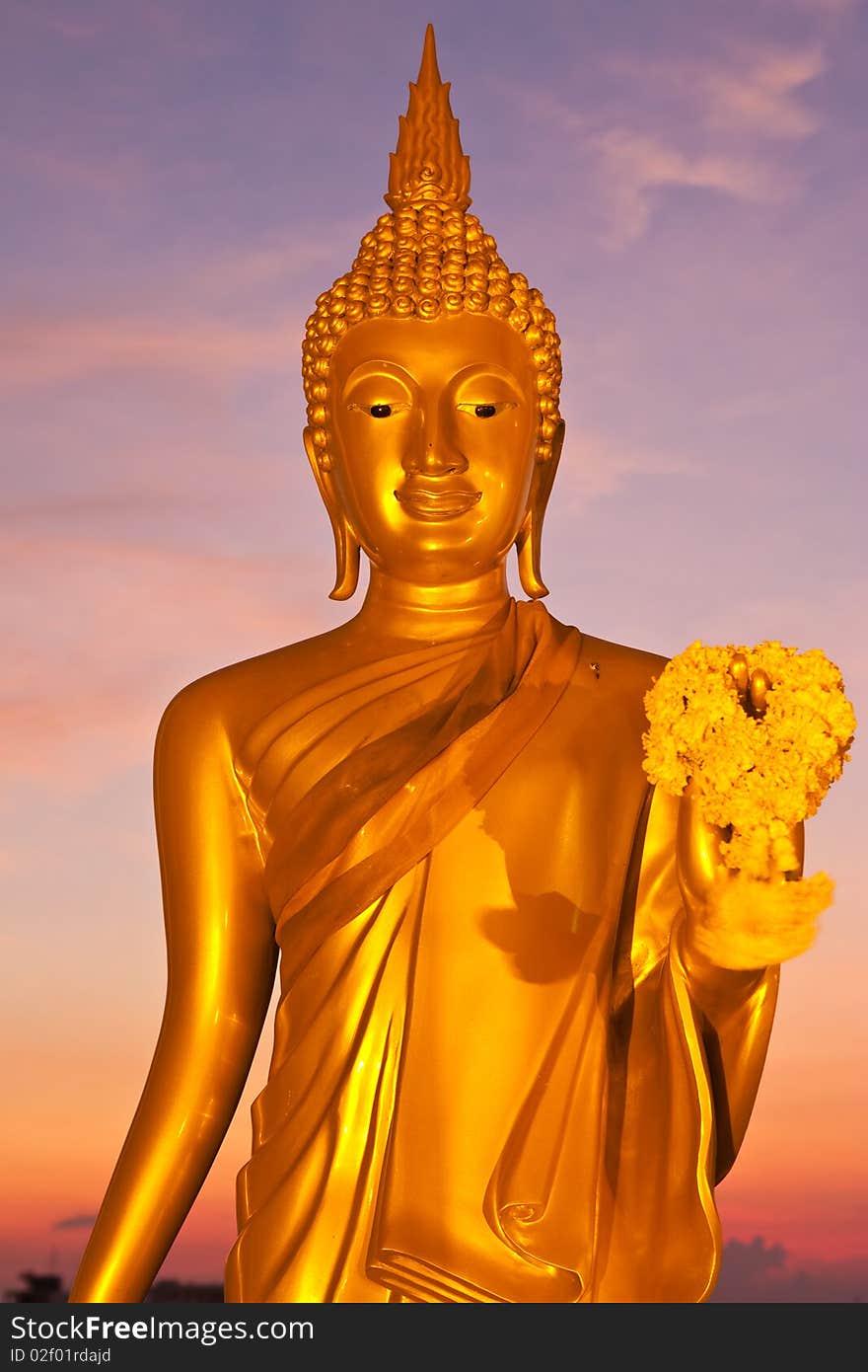 Golden standing Buddha image statue