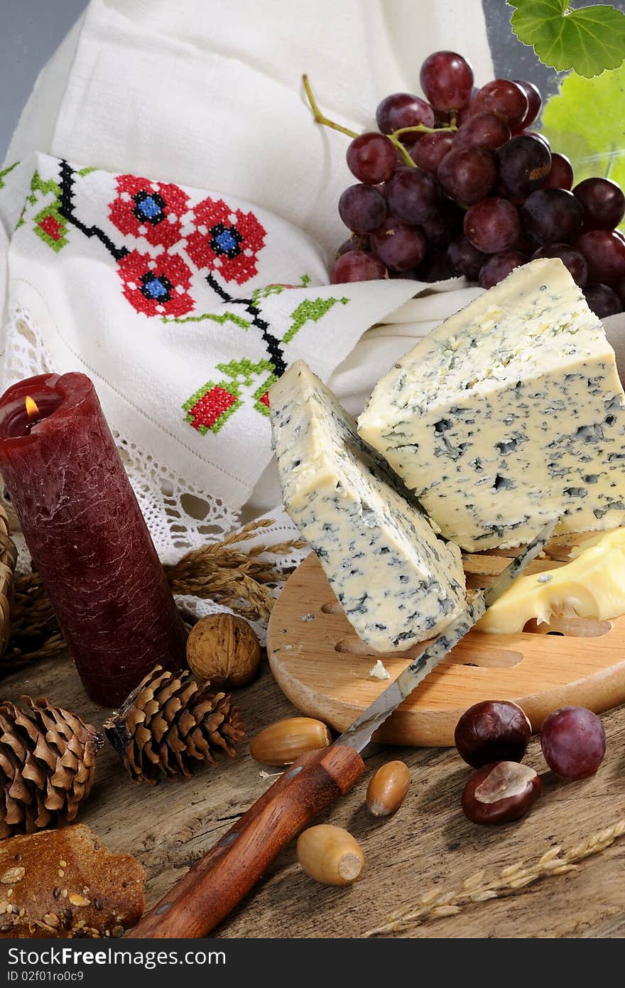 Closeup with blue cheese, fruits studio isolated, vintage mirror and traditional towel  in background. Closeup with blue cheese, fruits studio isolated, vintage mirror and traditional towel  in background