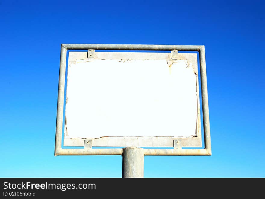 Old rusty blank billboard on sky background. Old rusty blank billboard on sky background