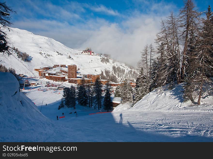 View on an alpine skiing resort. Winter sport vacation. View on an alpine skiing resort. Winter sport vacation