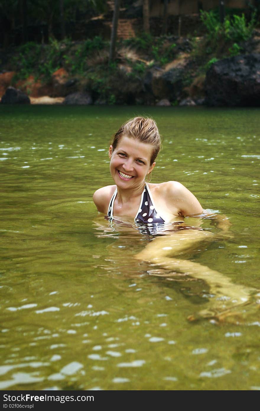 Young attractive woman having fun in tropical river. Young attractive woman having fun in tropical river