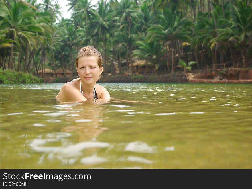 Young attractive woman having fun in tropical river. Young attractive woman having fun in tropical river