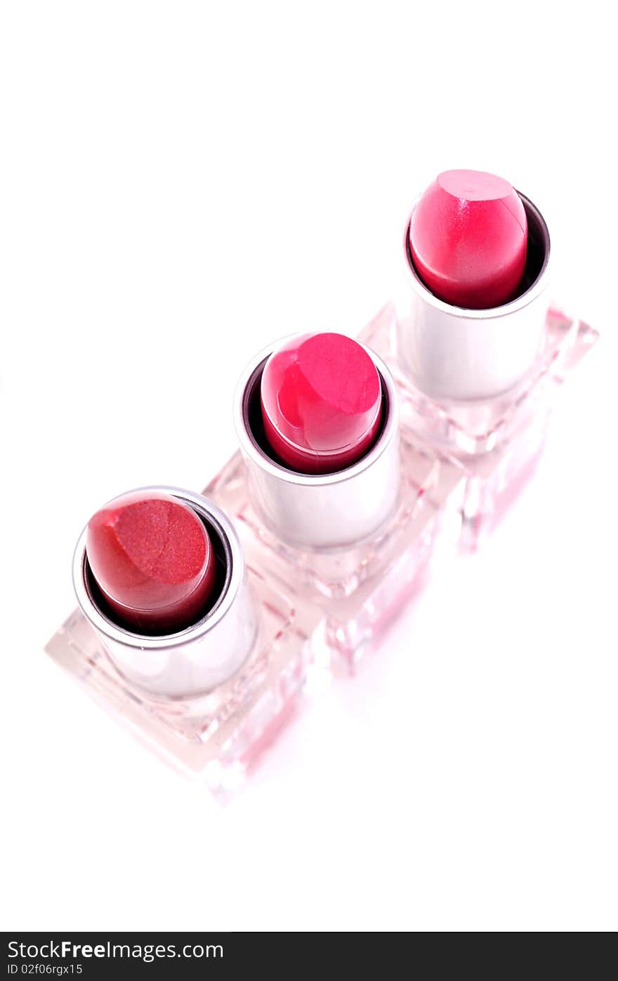 Red color lipsticks isolated on white background.