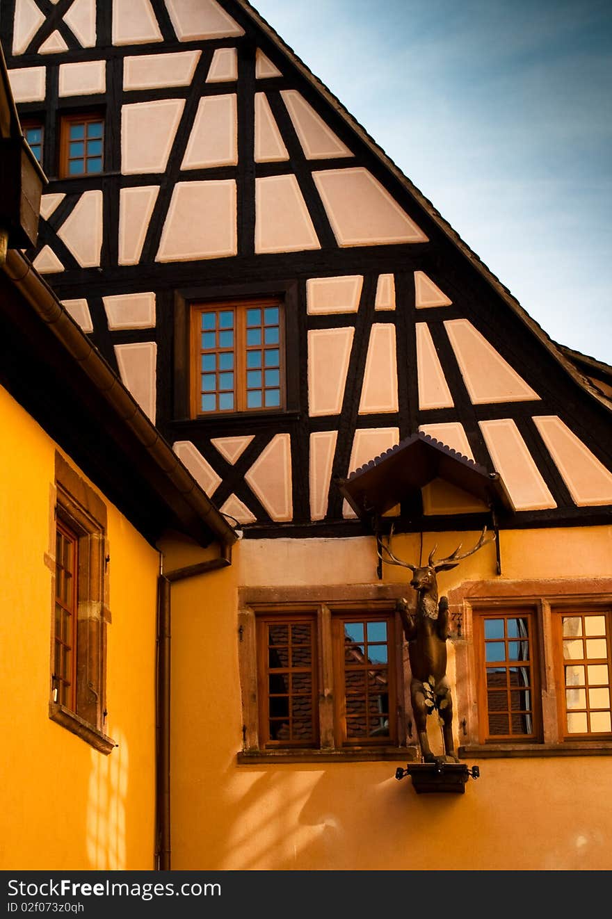 Traditional timber frame and stucco house in Riquewihr, , Alsace, France. Traditional timber frame and stucco house in Riquewihr, , Alsace, France